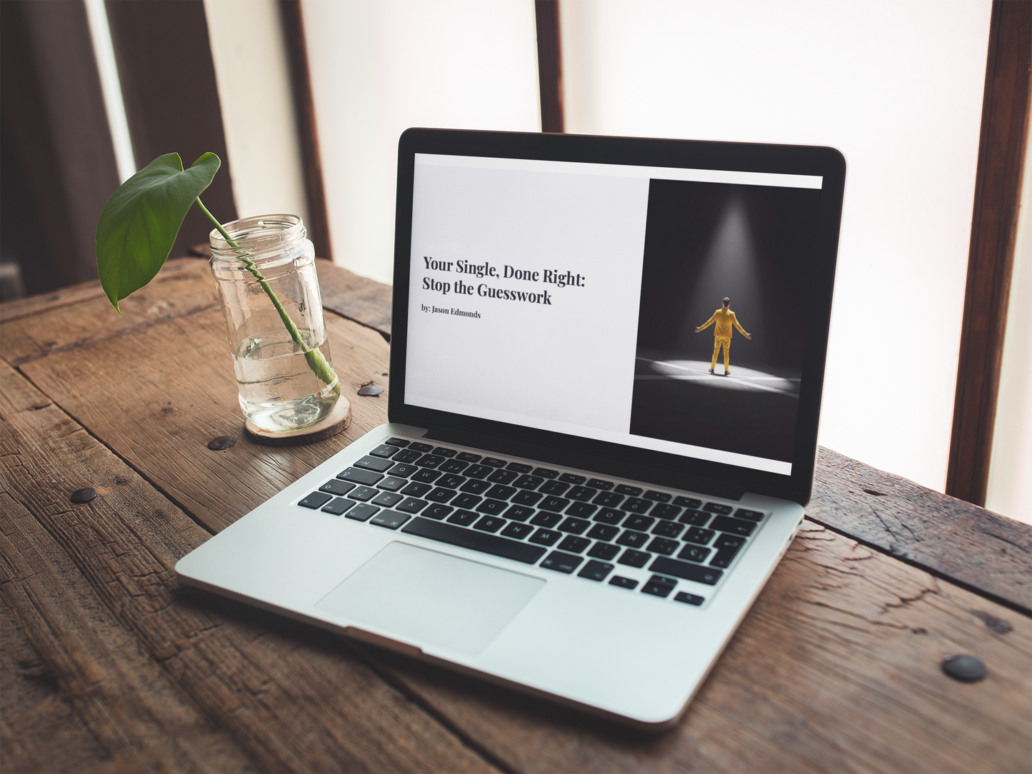 A computer screen displaying the cover of Your Single Done Right by Jason Edmonds, sitting atop a vintage wooden desk